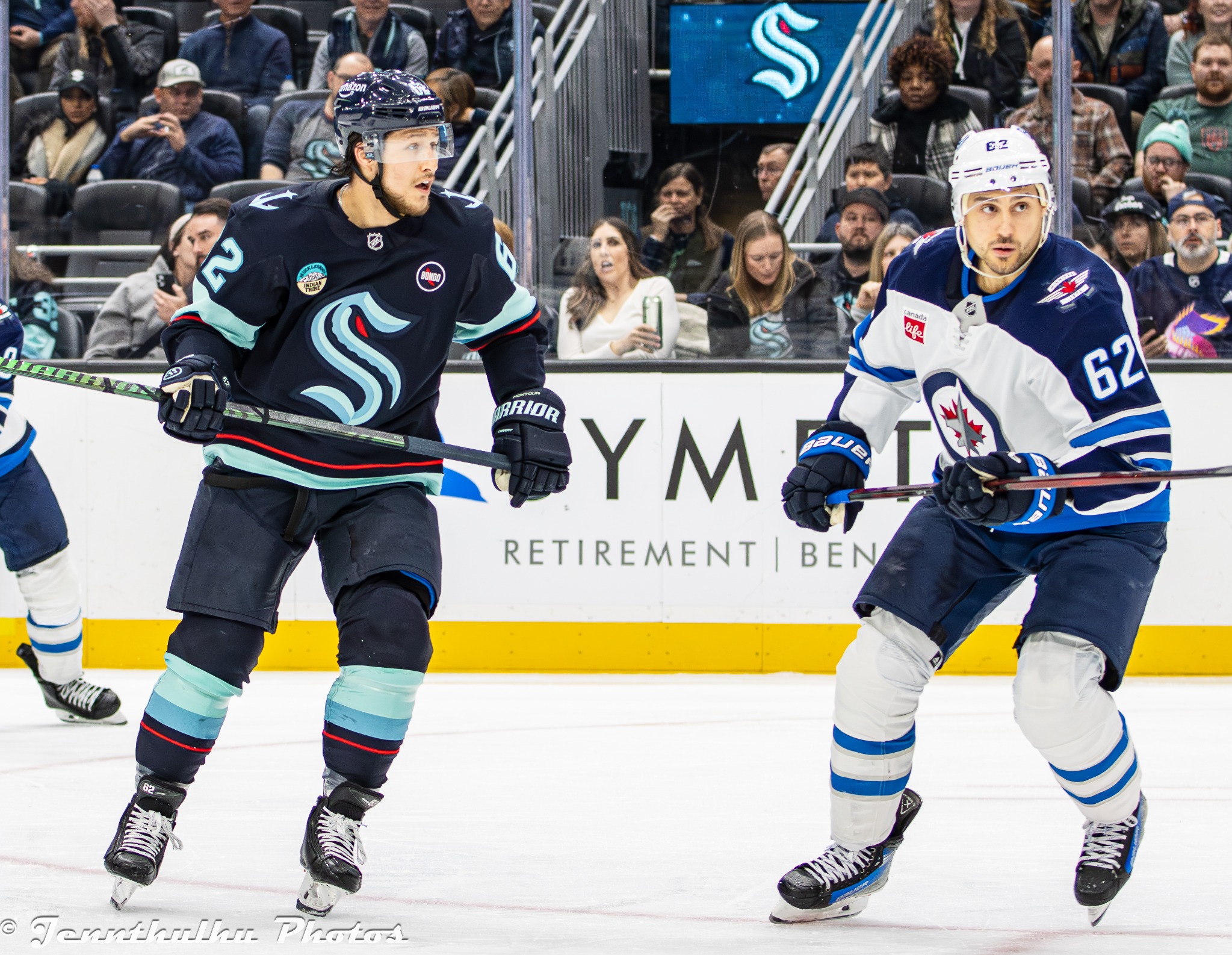 Seattle Kraken defenseman Brandon Montour and Winnipeg Jets forward Nino Niederreiter during NHL game action